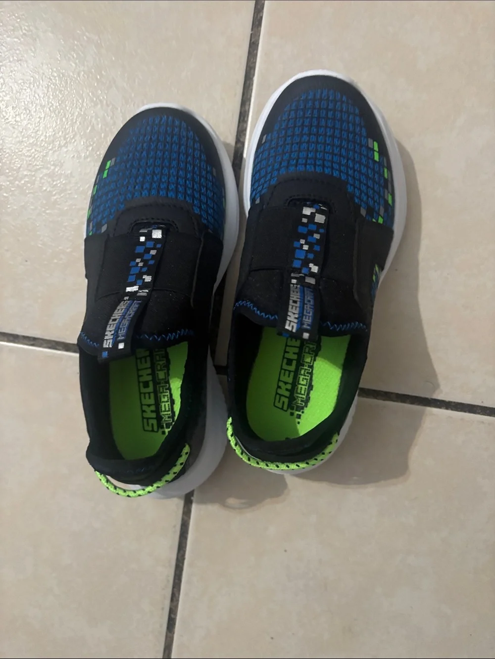Skechers Navy Blue and Black Slip-On Kids Sneakers with Green Accents